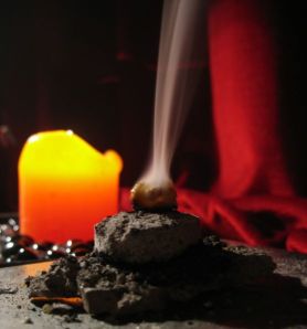 frankincense resin burning on charcoal